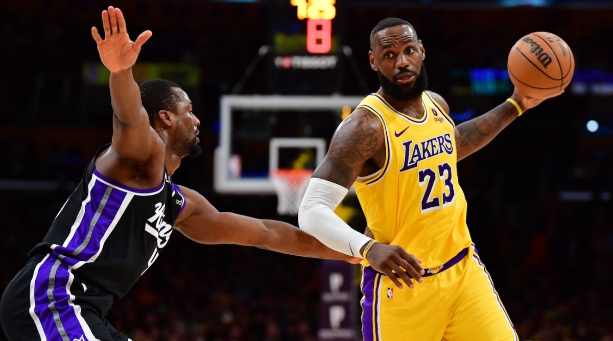 Los Angeles Lakers forward LeBron James controls the ball against Sacramento Kings forward Harrison Barnes (40) during the second half at Crypto.com Arena in Los Angeles on March 6, 2024.